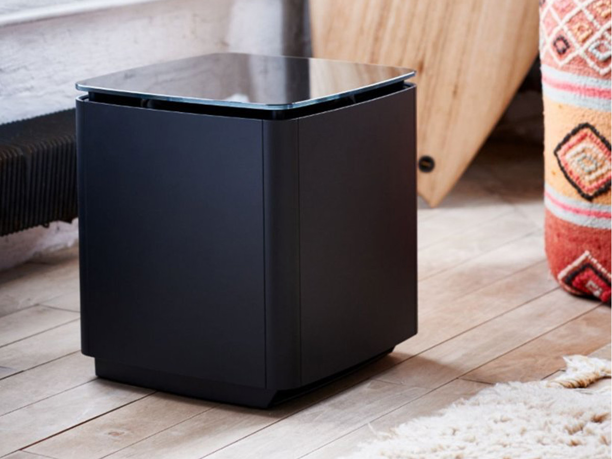 The Bose Bass Module 700 wireless subwoofer on a hardwood floor.