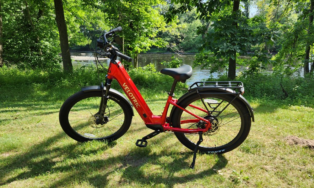 Velotric Discover 2 left profile view with parked by next to the Farmington River.