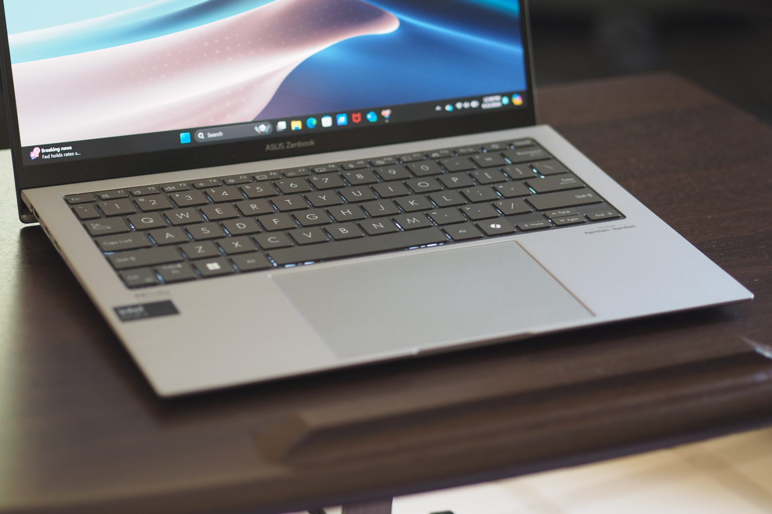 Asus Zenbook S 13 OLED 2024 front view showing keyboard and touchpad.