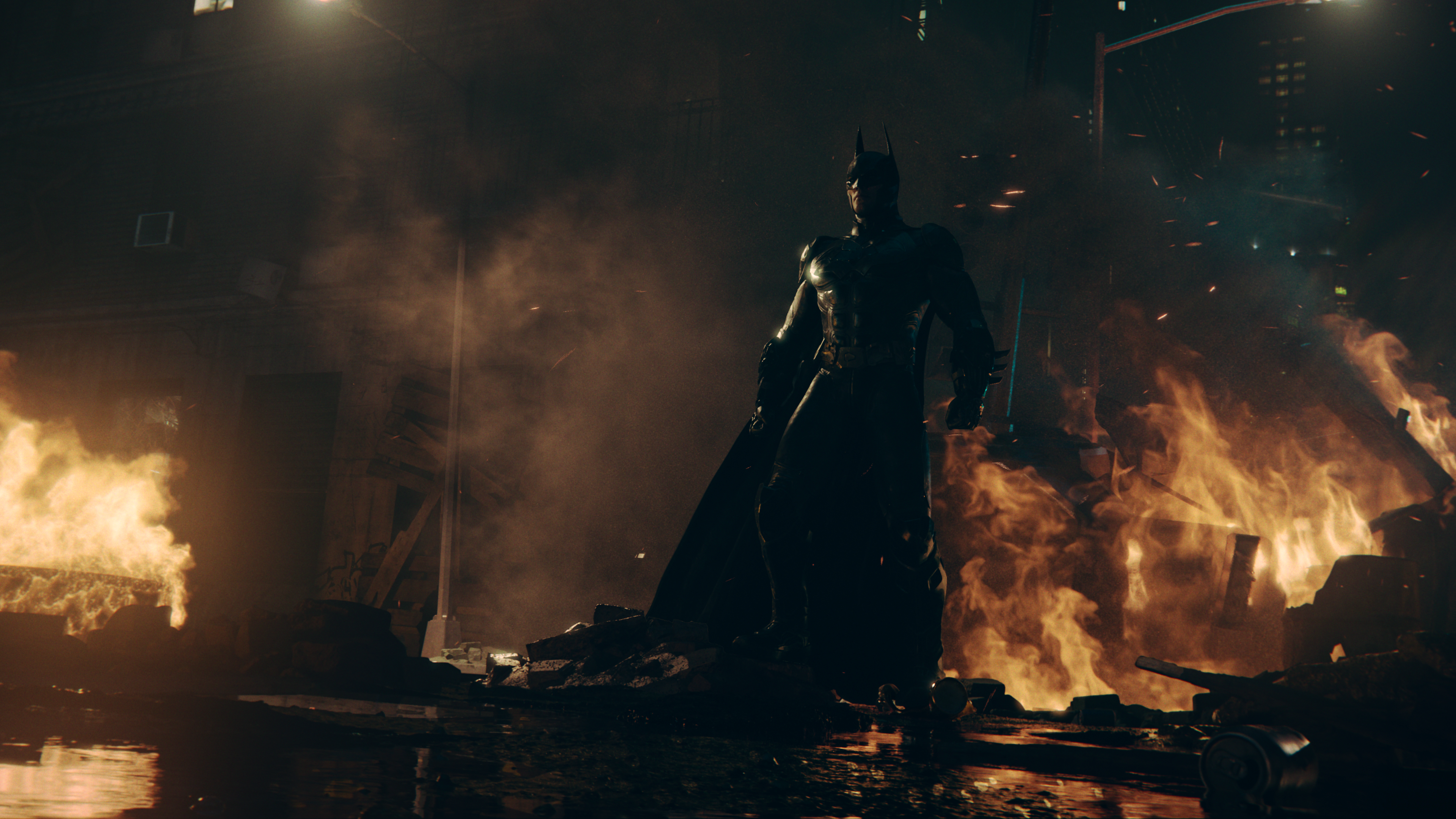 Batman steht in Batman: Arkham Shadow in der Nähe eines Feuers.