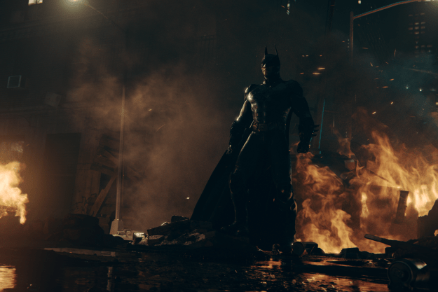 Batman stands near fire in Batman: Arkham Shadow.