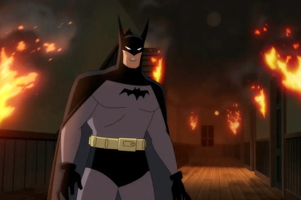 Batman se trouve dans un bâtiment en feu dans Batman : Caped Crusader.