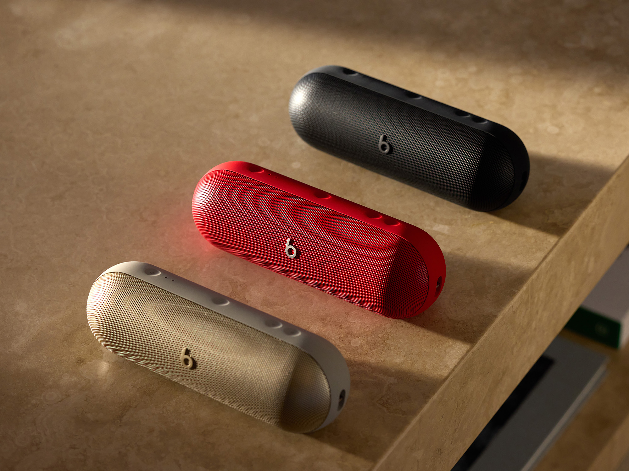 The three colors of Beats Pill: gold, red, and black.