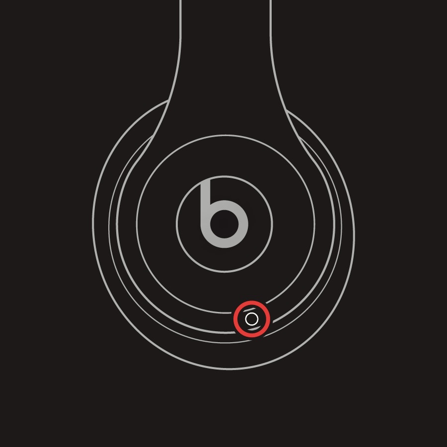 A red circle around the system button on the Beats Solo 4.