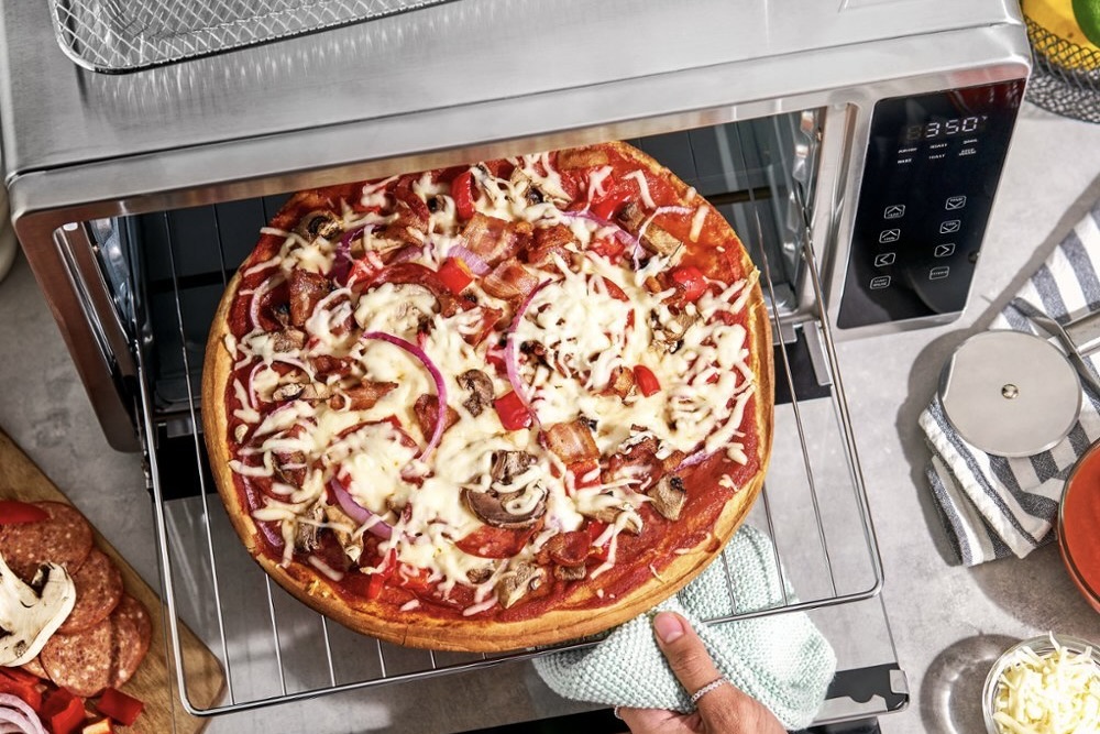 The Bella Pro Series being used to bake a pizza.
