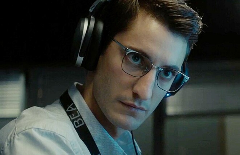 A man listens to his headphones in Black Box.