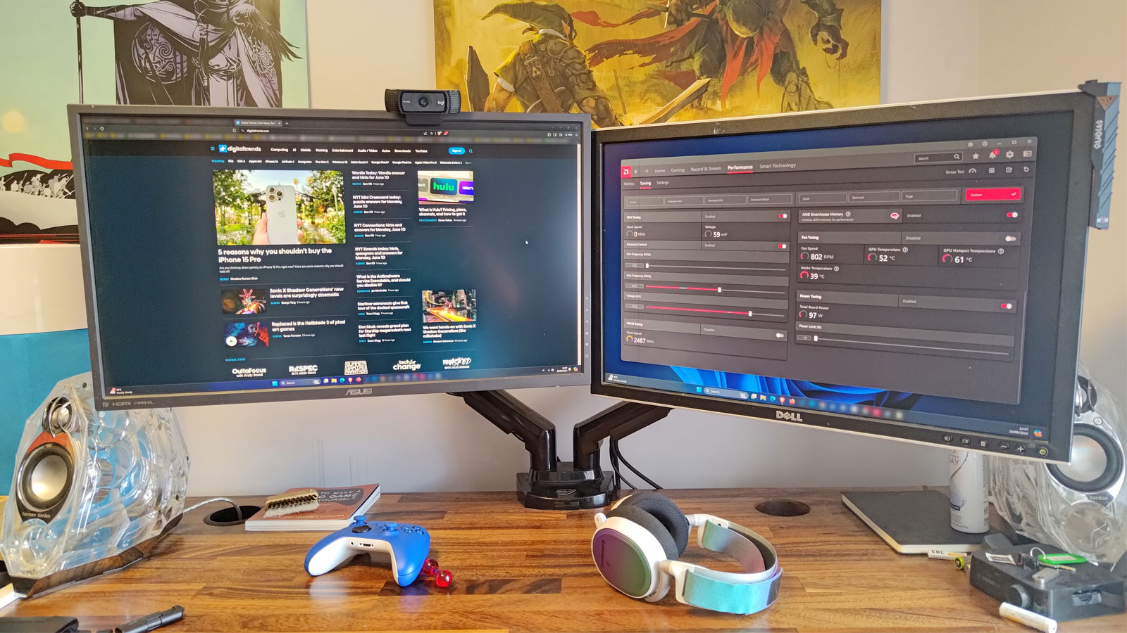 Pair of monitors on a desk with a monitor arm.