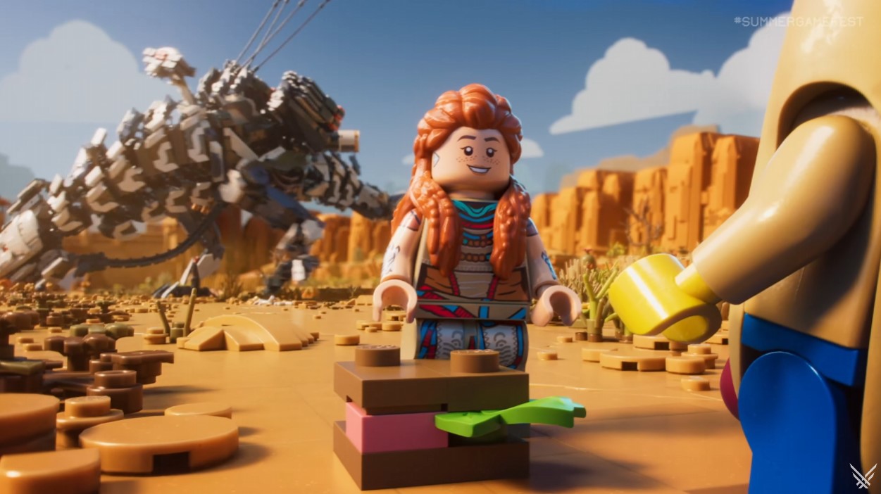 लेगो अलॉय हमला करने के लिए तैयार अपने पीछे एक मशीन के साथ लेगो हॉटडॉग लड़के से बात कर रही है।
