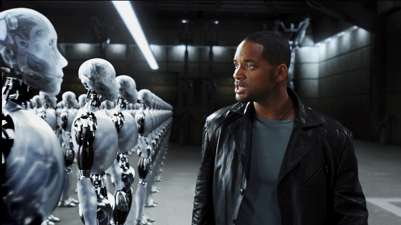 Will Smith looking at a row of robots in I, Robot.
