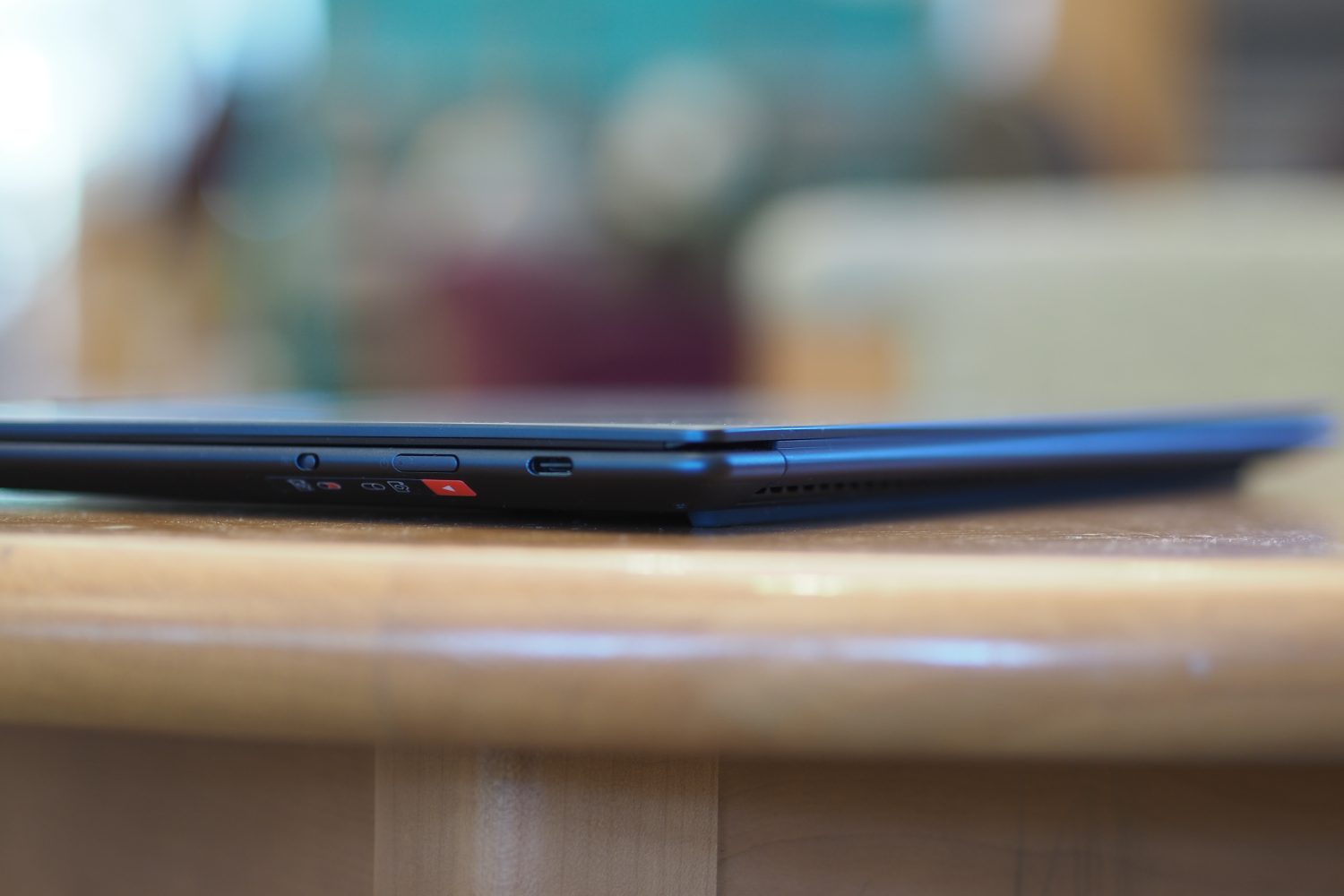Lenovo Yoga Slim 7x side view showing ports and vents.
