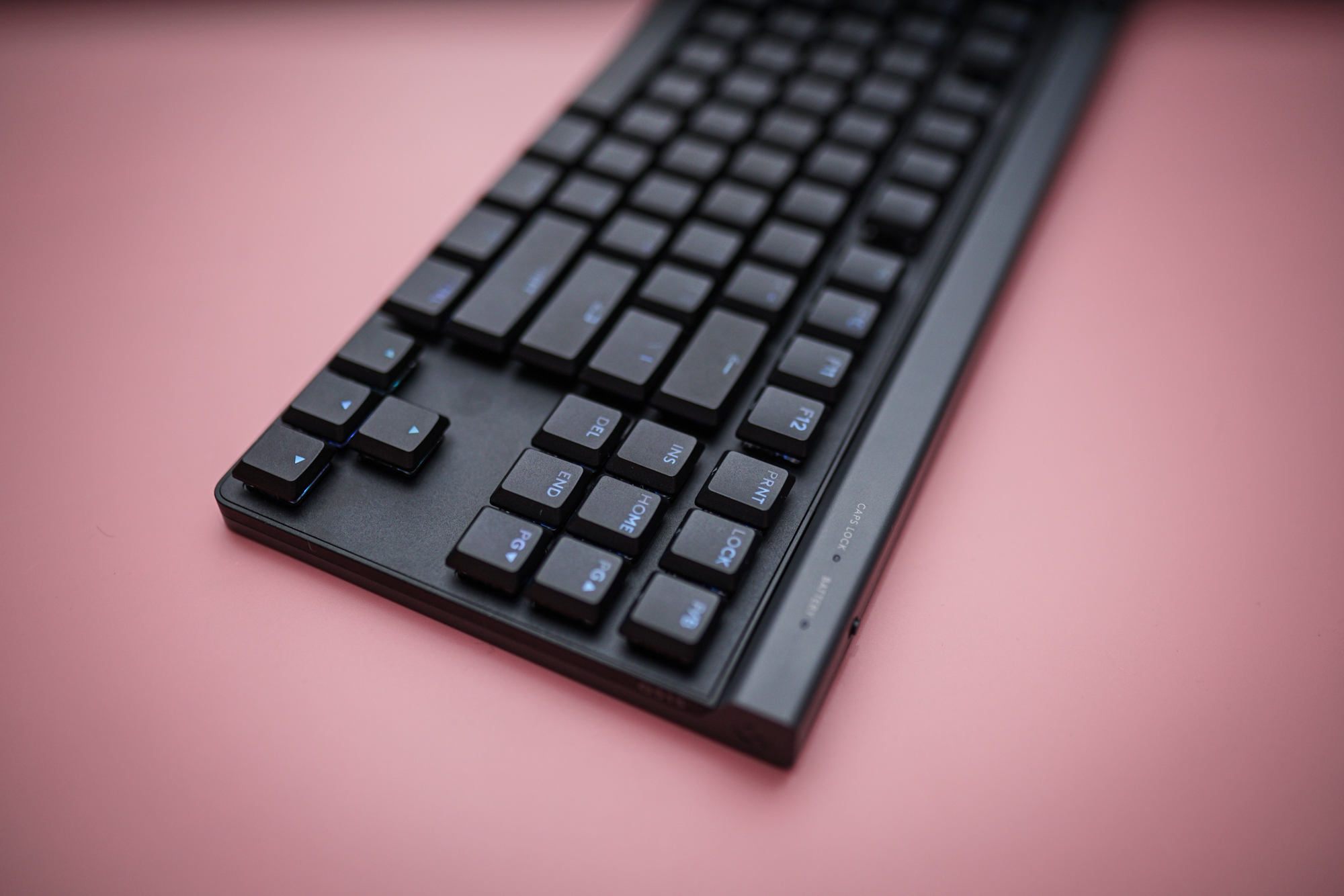 The Logitech G515 sitting on a pink background.