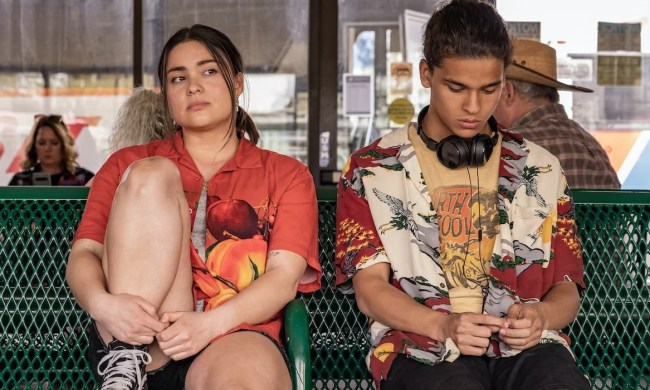 Two teens sit on a bench in Reservation Dogs.