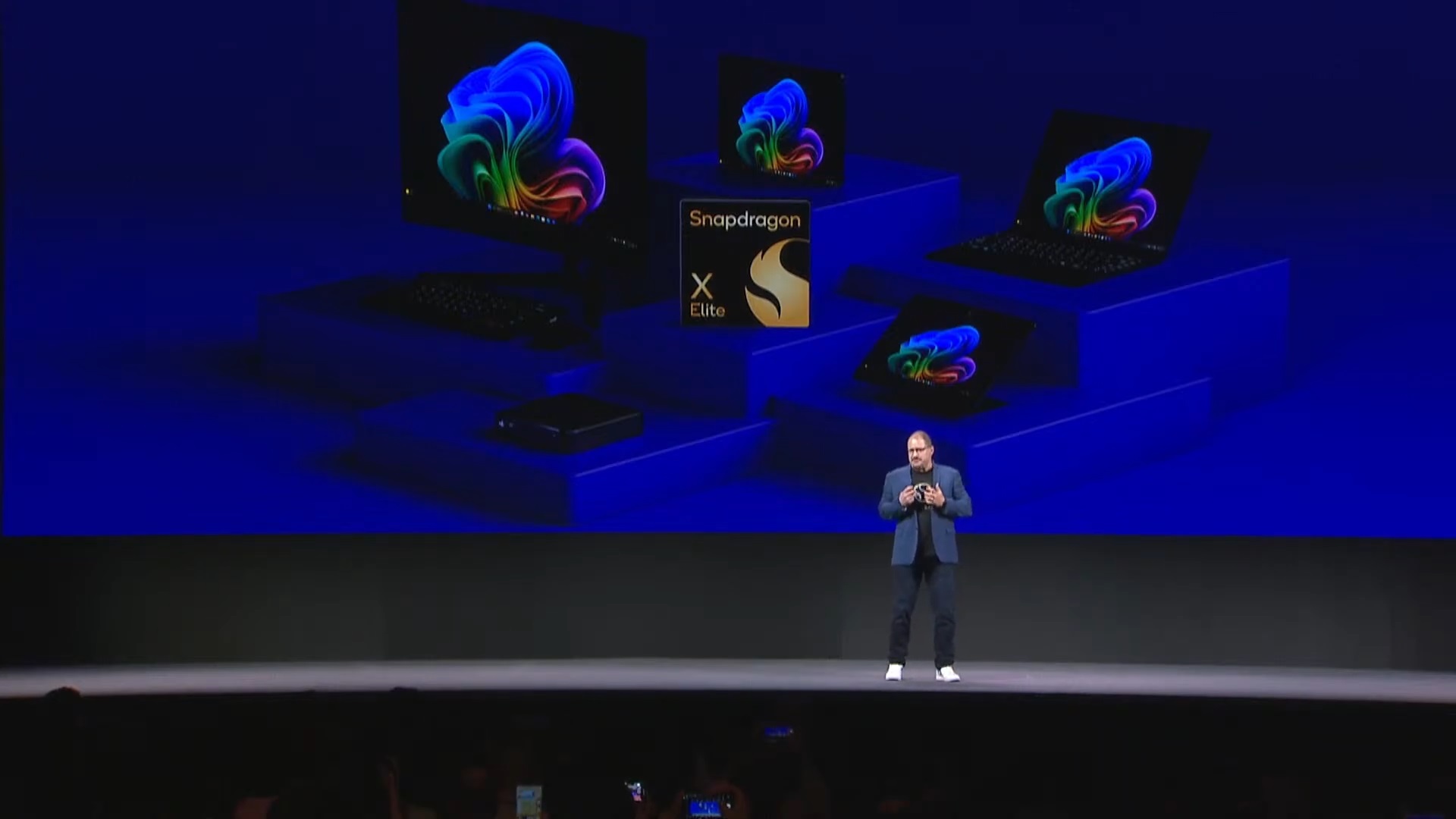 Qualcomm's CEO presenting different form factors with Snapdragon CPUs at Computex 2024.