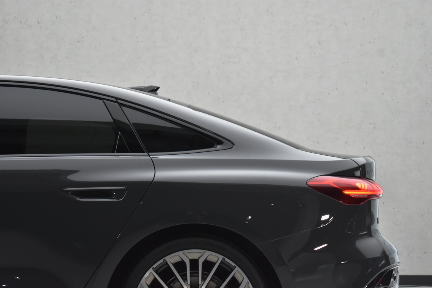 Detail of the rear roof pillar of a 2025 Audi A5 sedan.