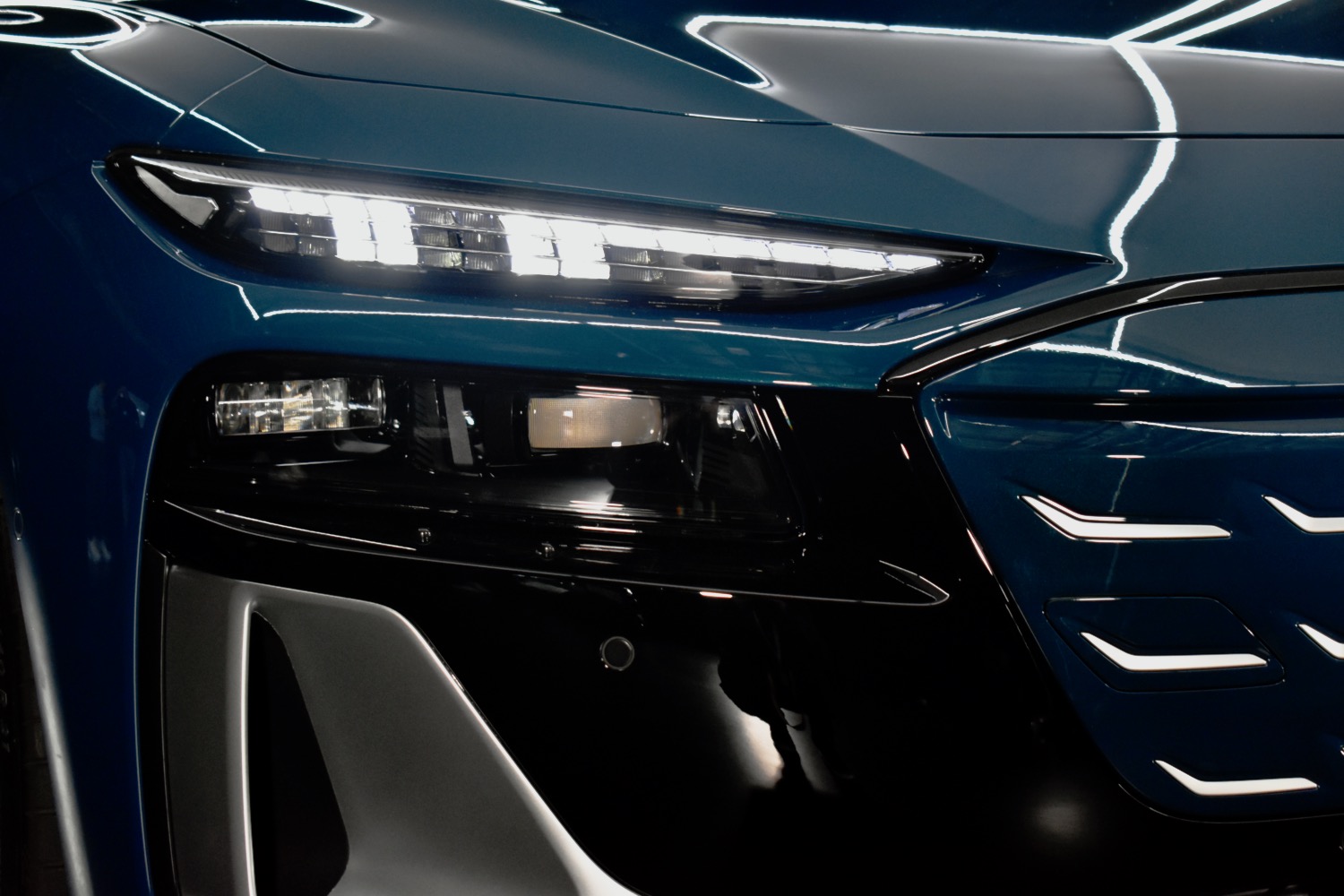 Close-up of 2025 Audi A6 e-tron headlight.