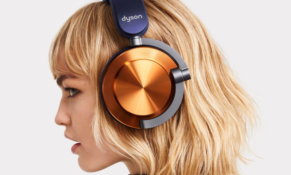 Side view of woman wearing Dyson OnTrac headphones.