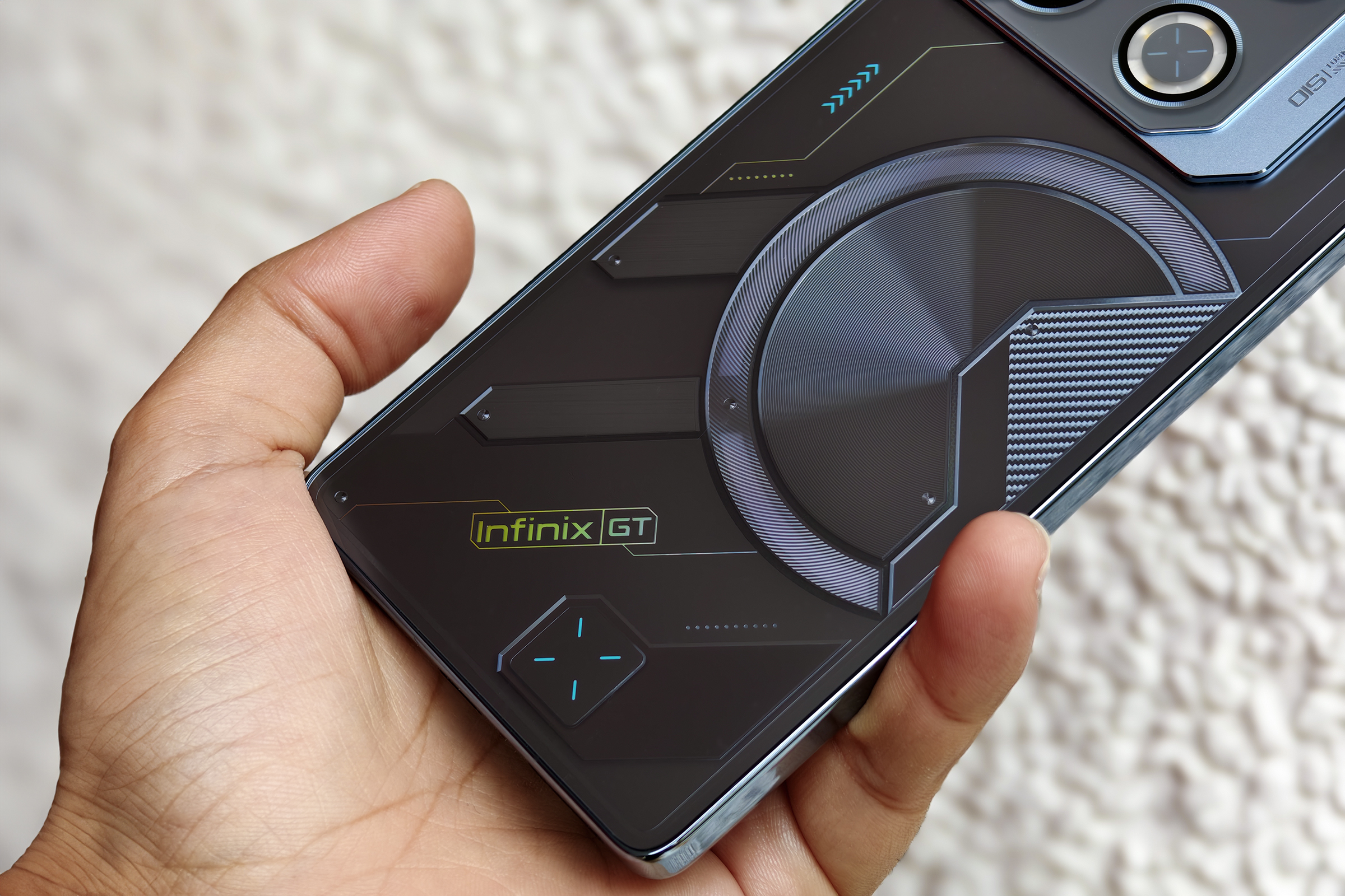 Infinix GT 20 Pro gaming phone held in hand.