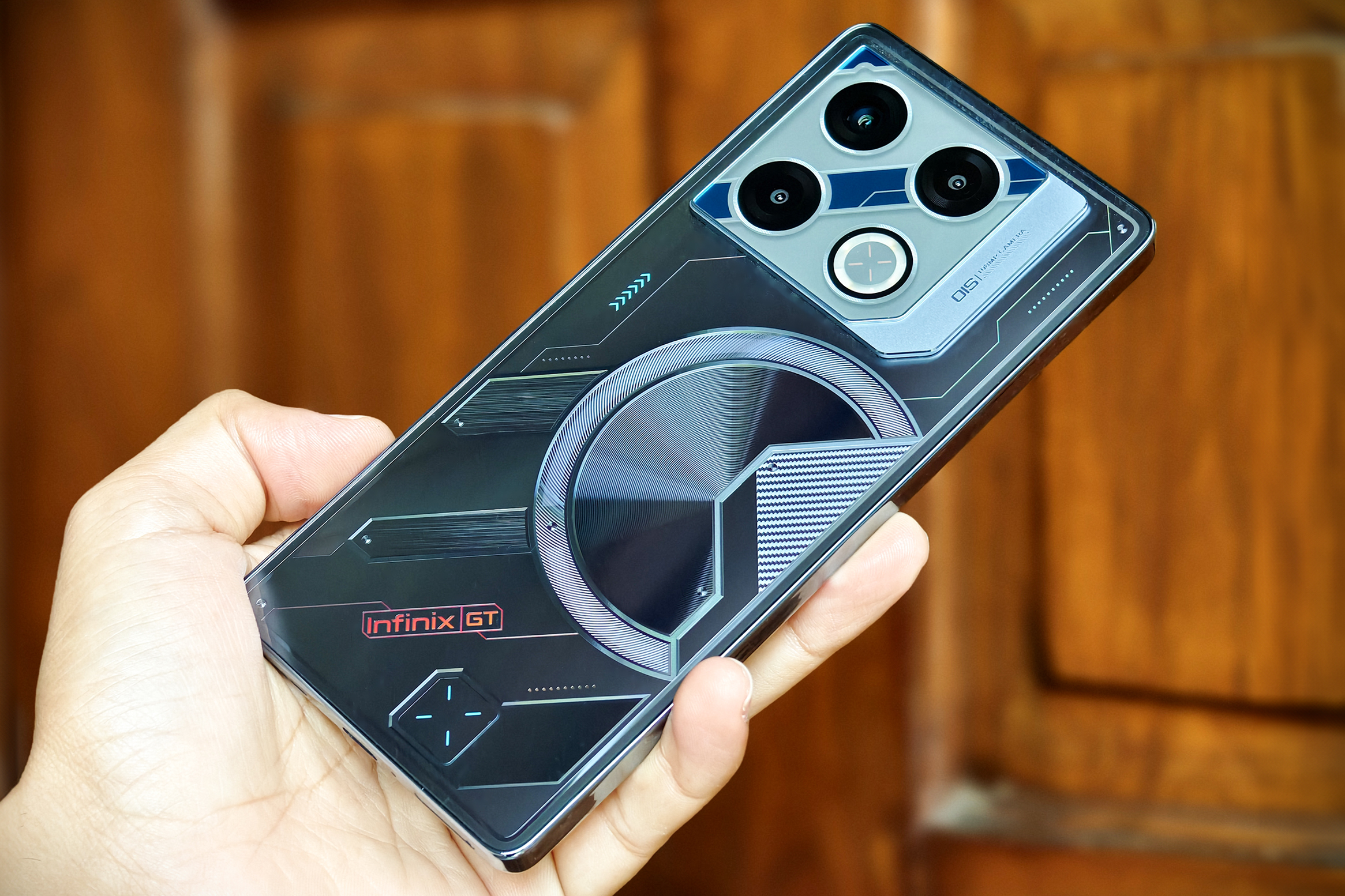 Infinix GT 20 Pro gaming phone held in hand.