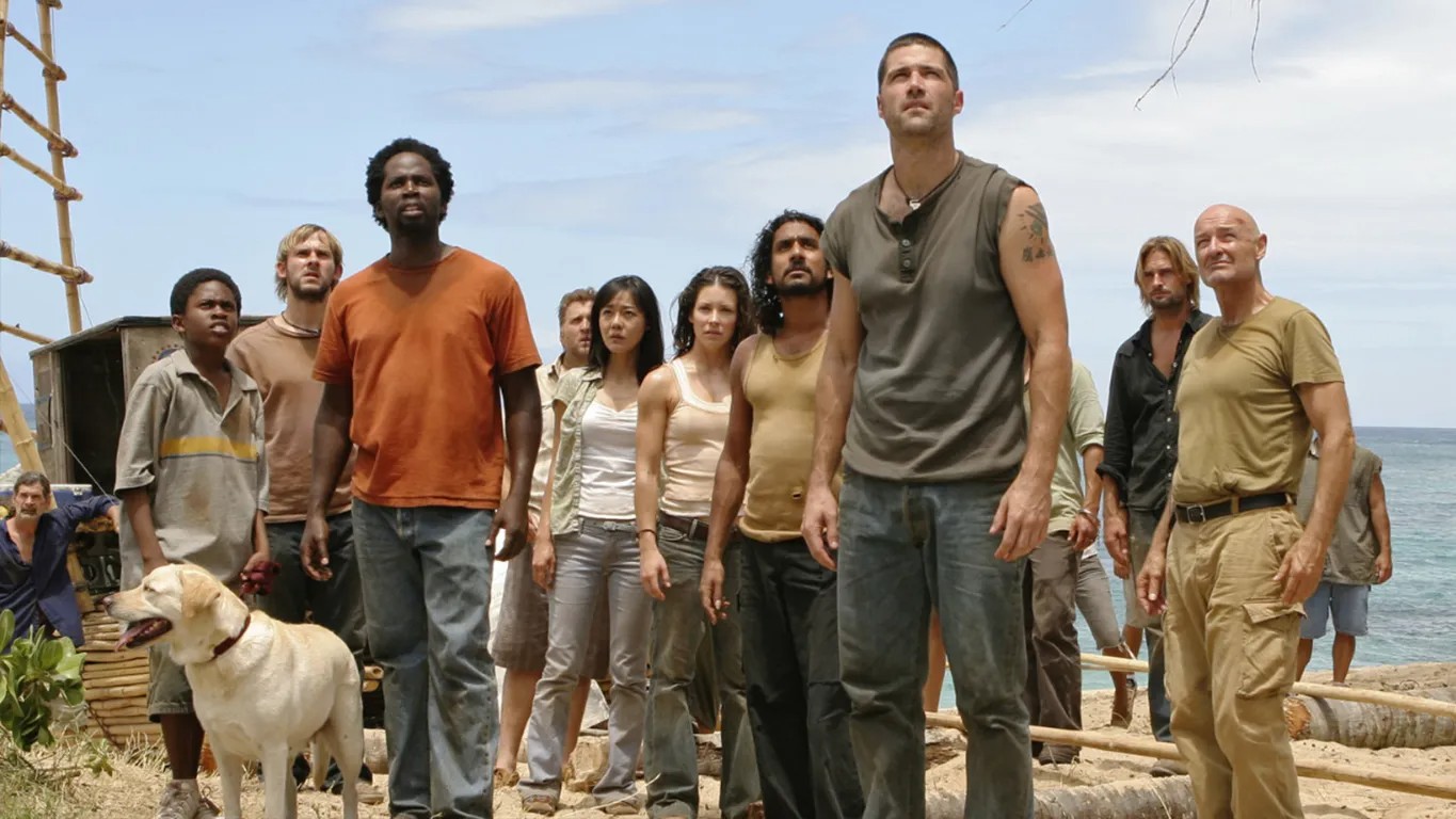 Un grupo de personas mira hacia arriba en Lost.