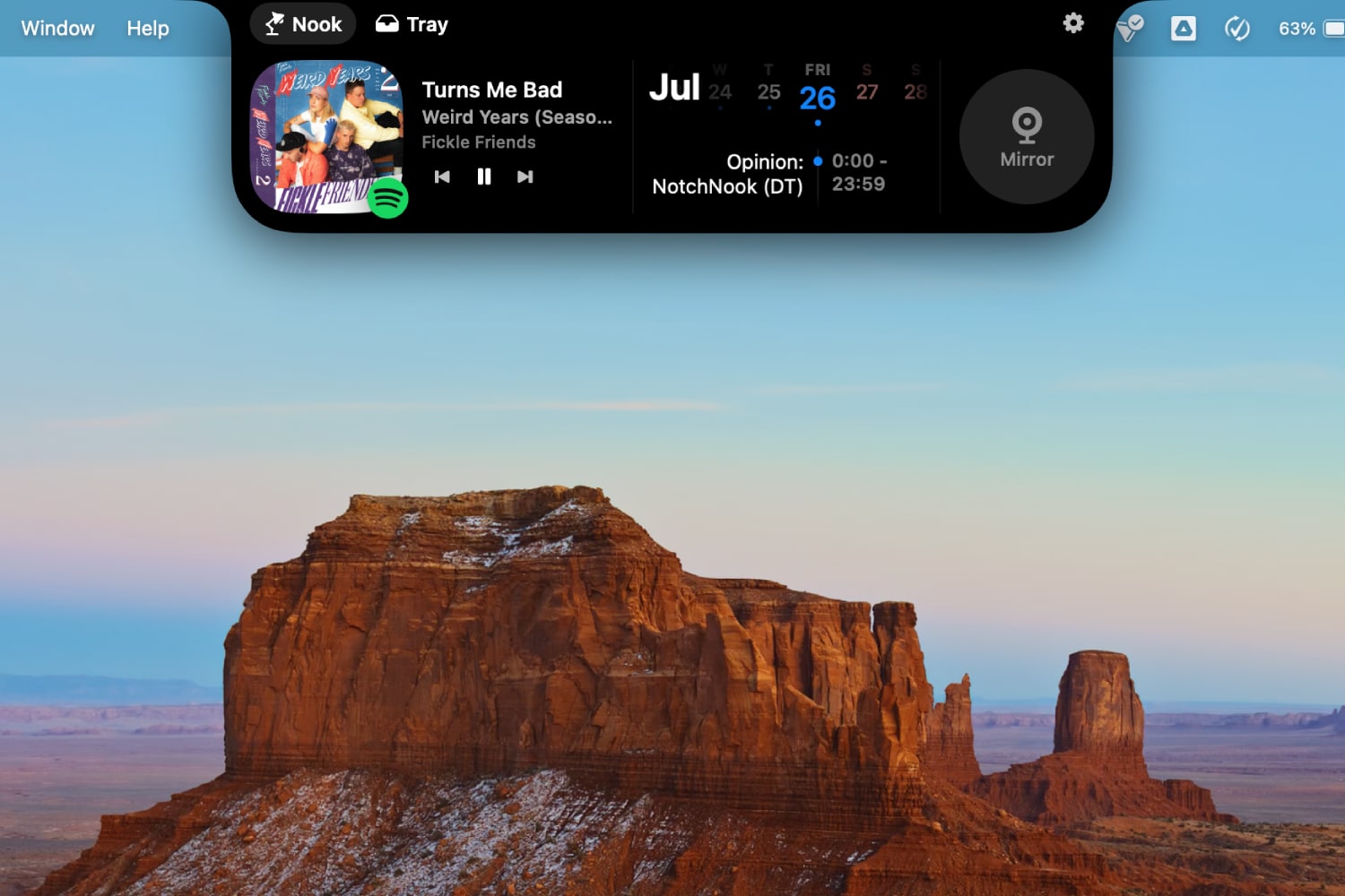 NotchNook running in macOS, with the nook expanded to show Spotify controls and a calendar.