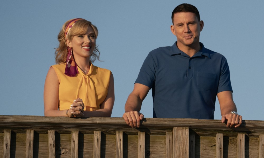 Scarlett Johansson and Channing Tatum lean on a pier railing in Fly Me to the Moon.