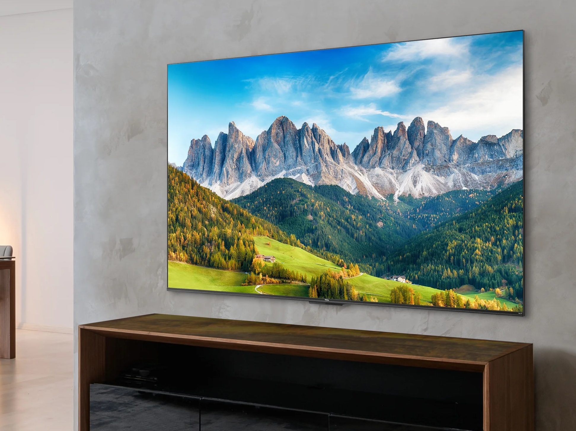 The TCL 55" Class 4-Series 4K UHD HDR Smart Roku TV - 55S451 mounted on a wall.