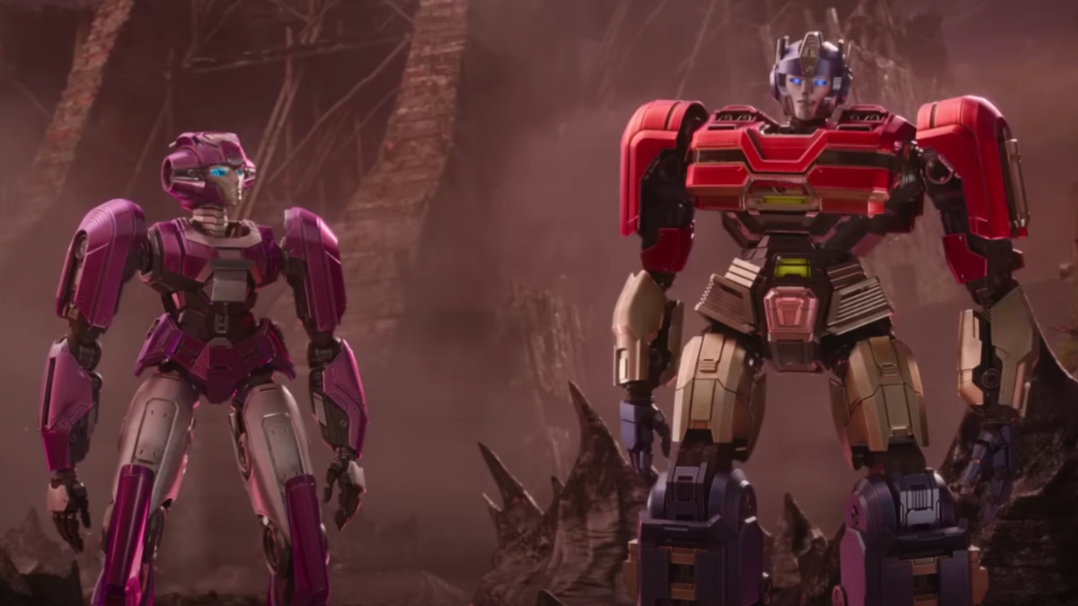 Two robots stand next to each other in Transformers One.