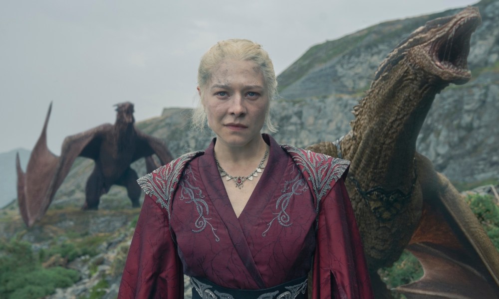 Two dragons roar behind Rhaenyra in House of the Dragon season 2.