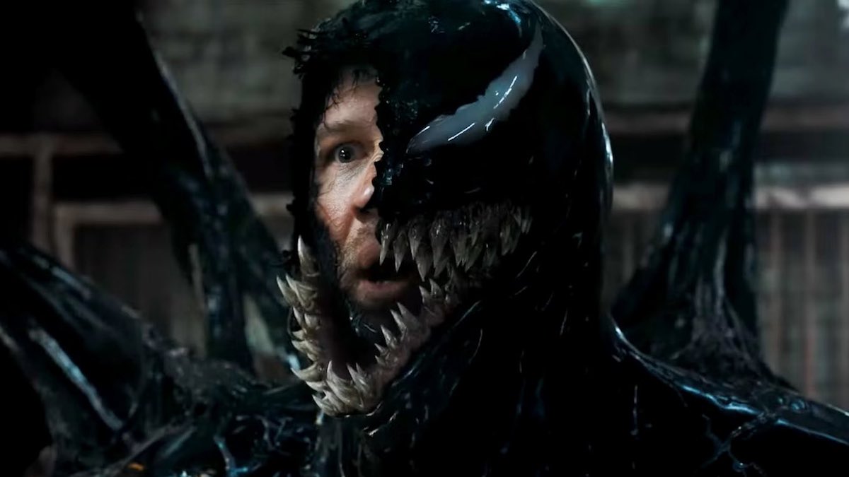 Tom Hardy in the Venom suit as he looks confused.