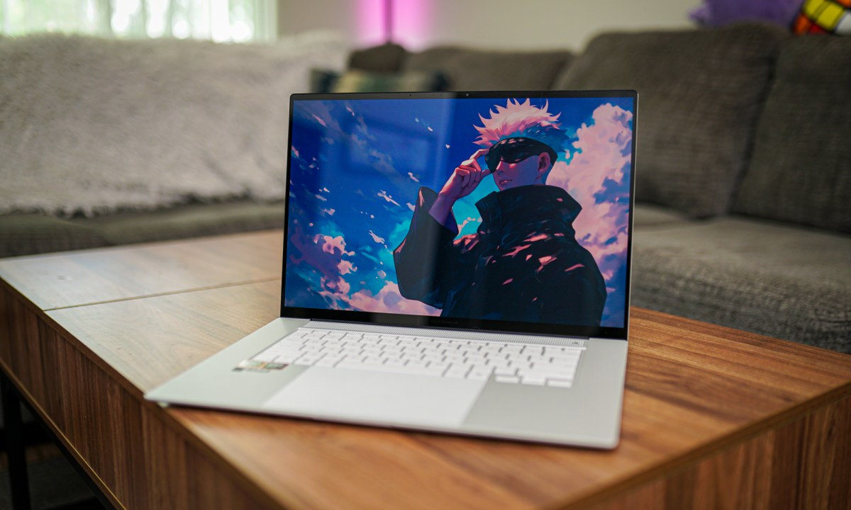 The Asus Zenbook S 16 sitting on a coffee table.