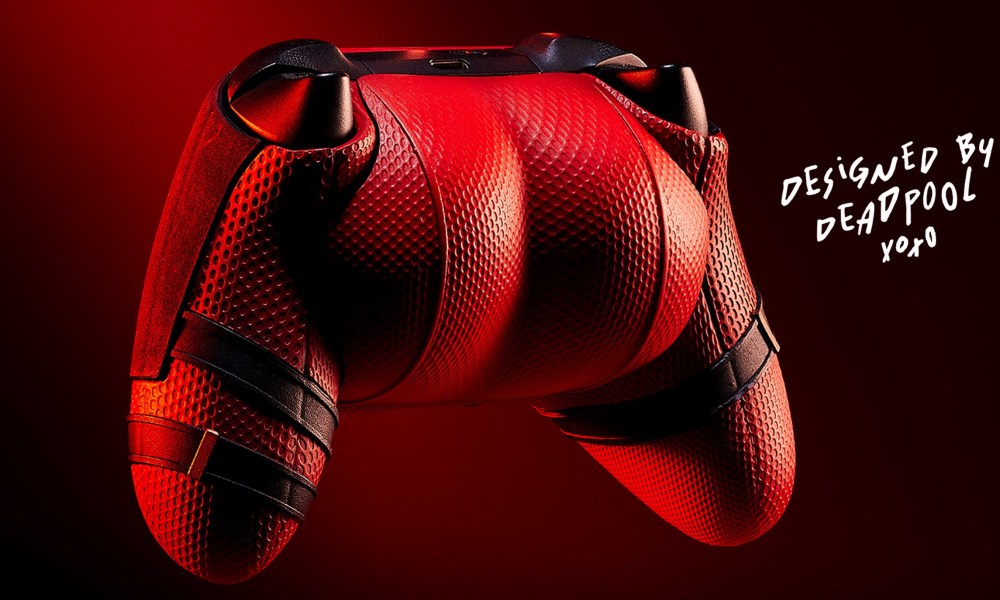 A closeup of the Deadpool butt controller. It's red and the back looks like Deadpool's butt cheeks. The text on the image says "Designed by Deadpool xoxo"