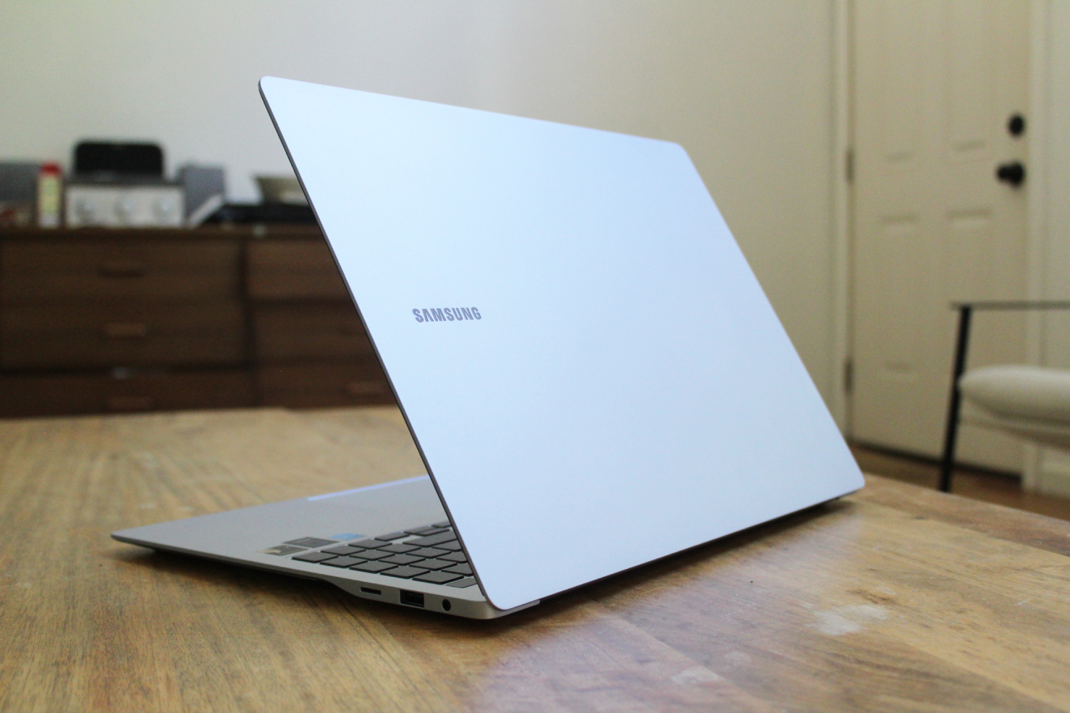 The Galaxy Book4 Edge open, showing the lid on a table.