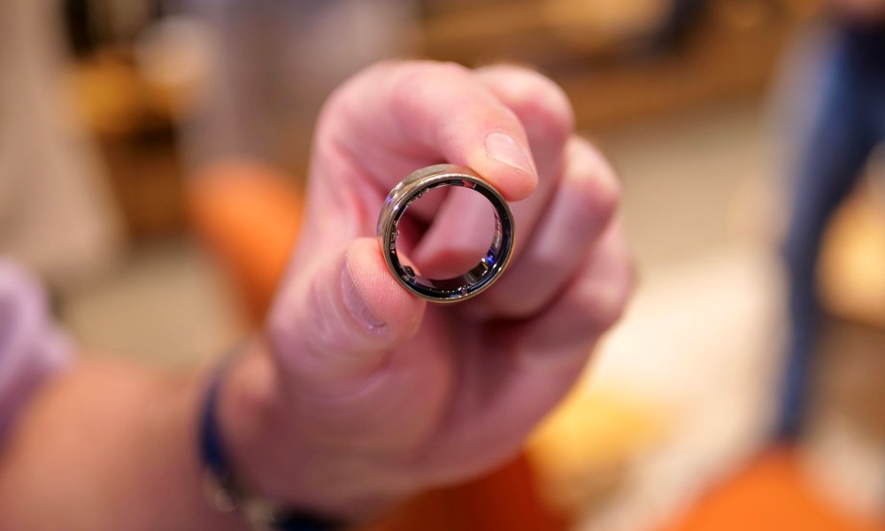 A person holding the Samsung Galaxy Ring.