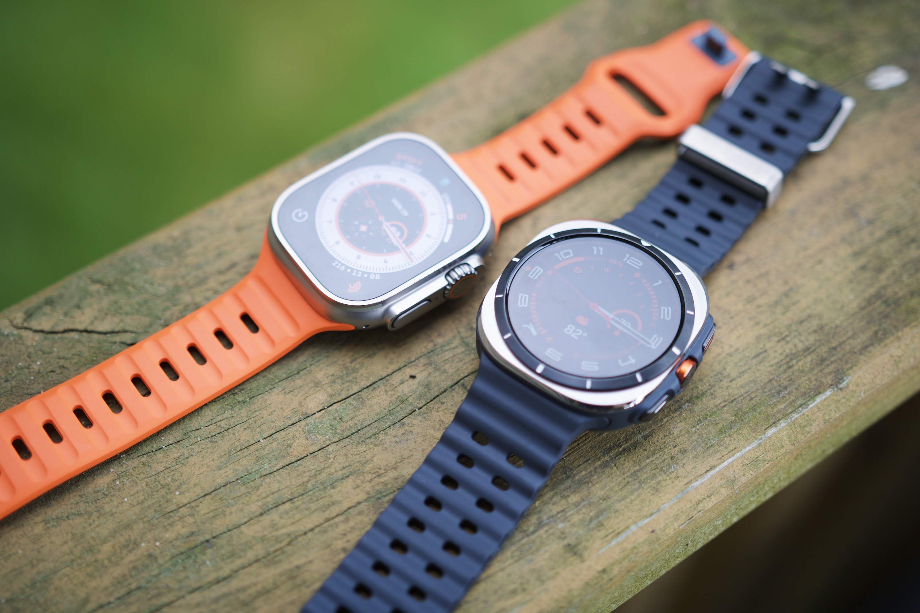 The Samsung Galaxy Watch Ultra and Apple Watch Ultra 2 sitting next to each other.