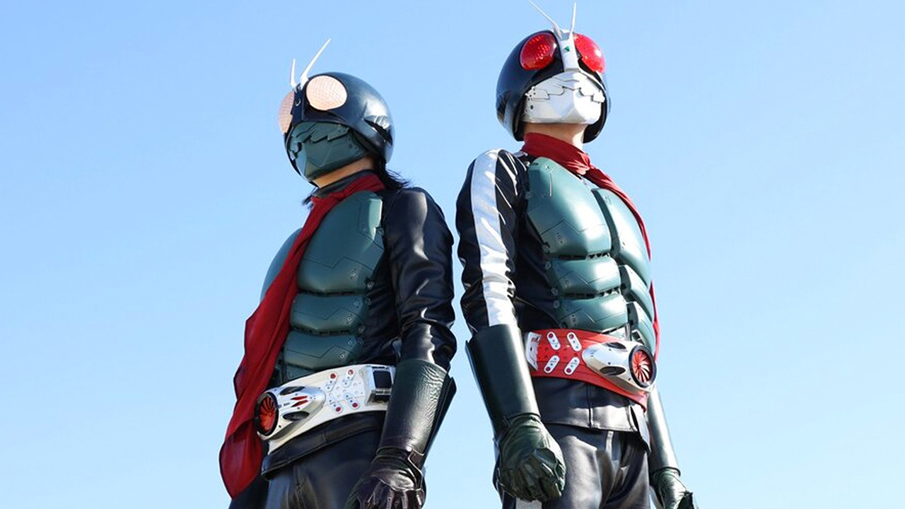 Two people wearing masks and cyborg uniforms in Shin Kamen Rider.