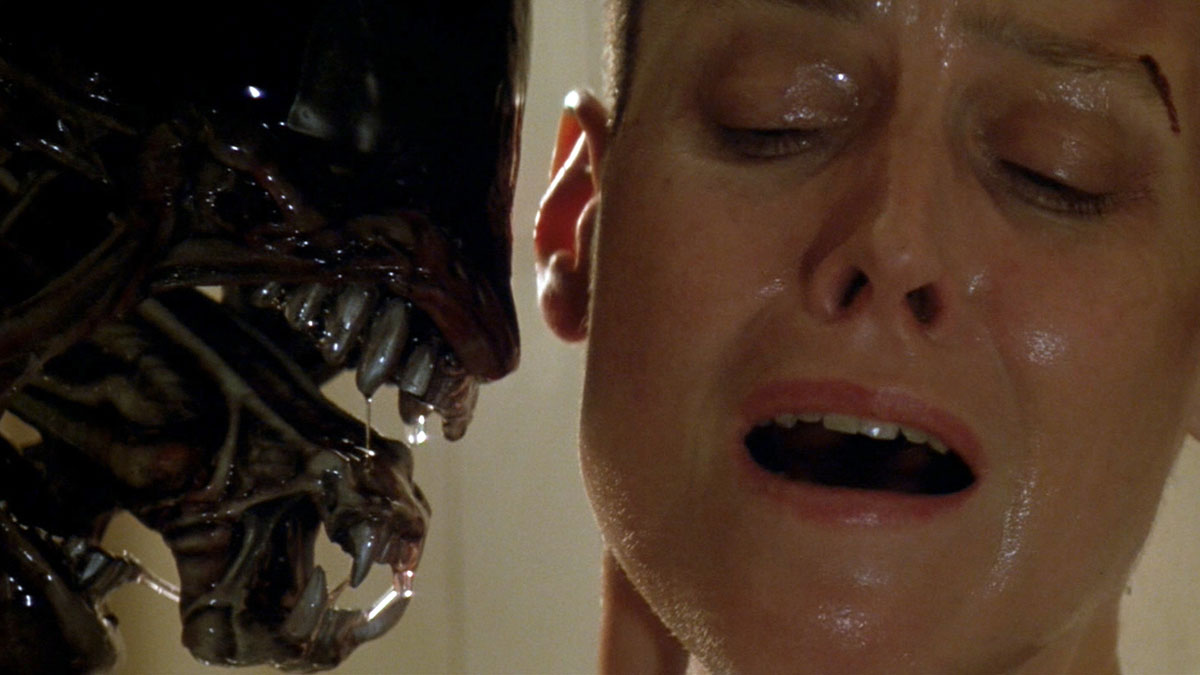 A xenomorph menaces Sigourney Weaver's Ripley in Alien 3.