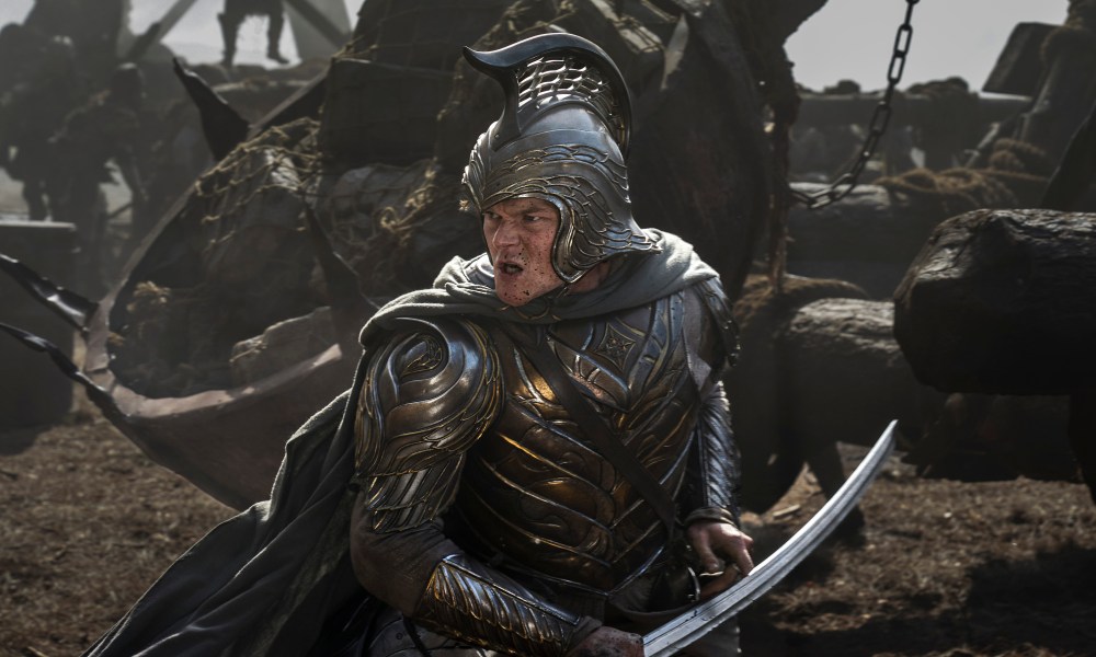 An armor-clad Elrond wields an Elvish sword in The Lord of the Rings: The Rings of Power season 2.