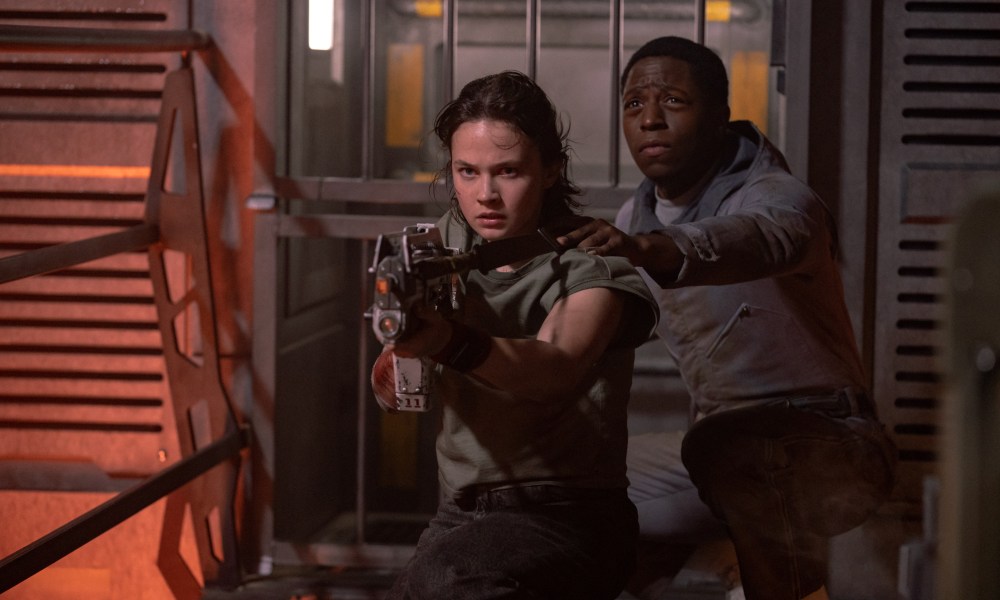 Andy holds onto Rain's shoulder in Alien: Romulus.