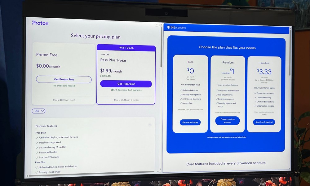 Bitwarden and Proton Pass pricing appears in a split-screen on a PC monitor.