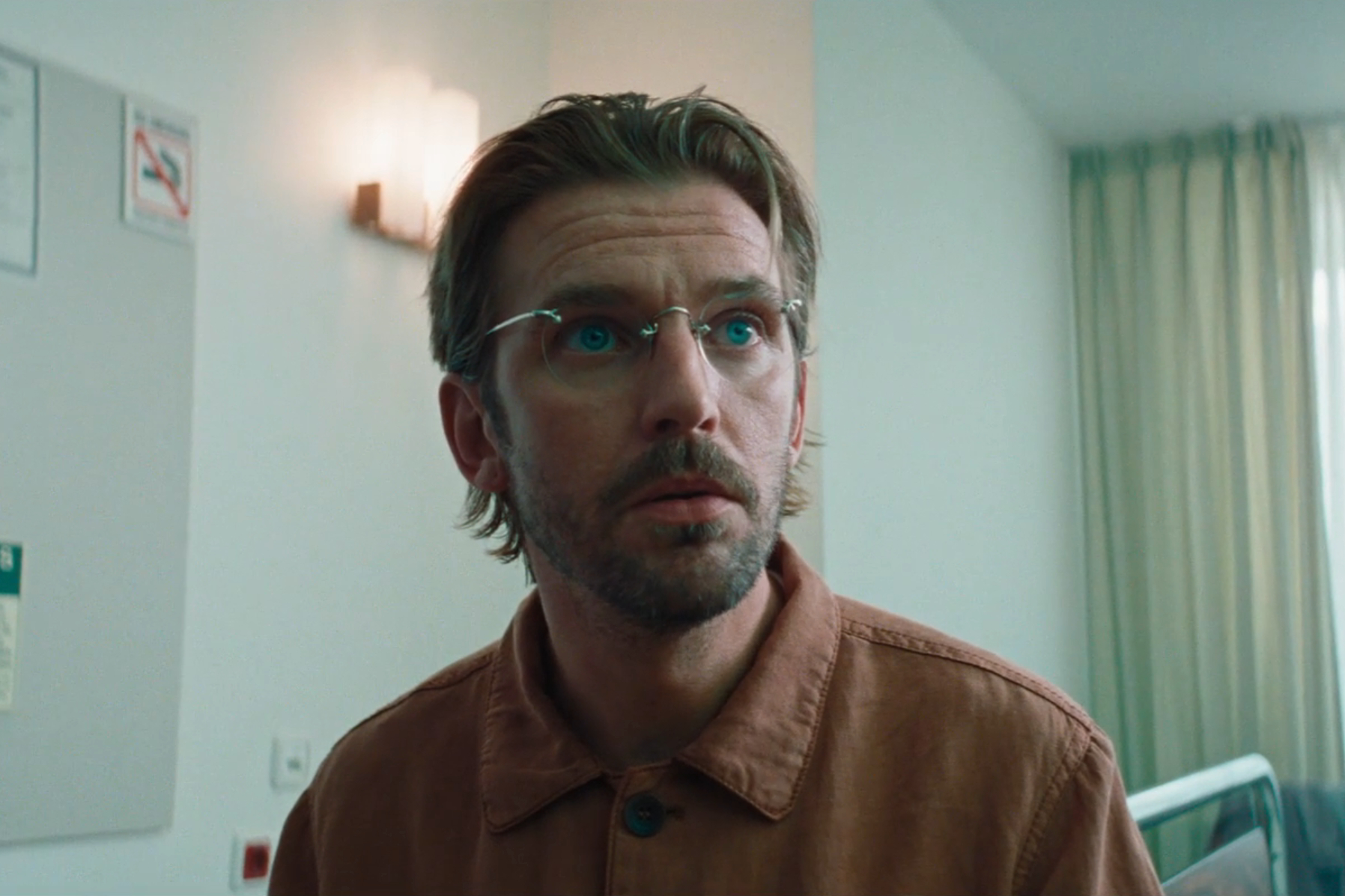 Dan Stevens sits in a hospital room in Cuckoo.