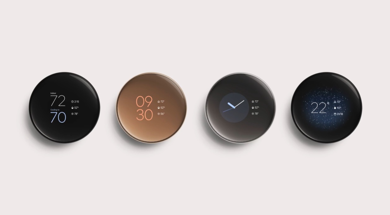 Four Nest Learning Thermostats lined up in a row.