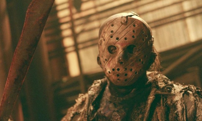 Jason Voorhees holds up a knife and stares.