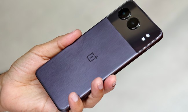 OnePlus Nord 4 Midnight black with metal back held in hand.