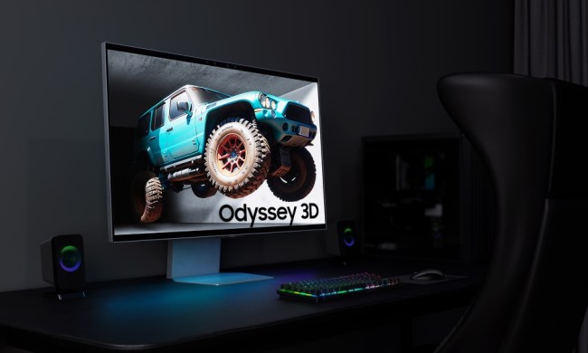 The Samsung Odyssey 3D monitor placed on a desk.