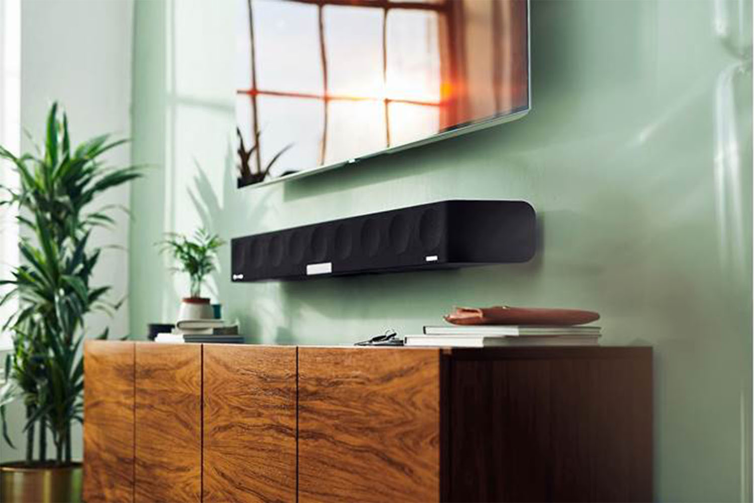 A Sennheiser AMBEO Soundbar attached to a wall.