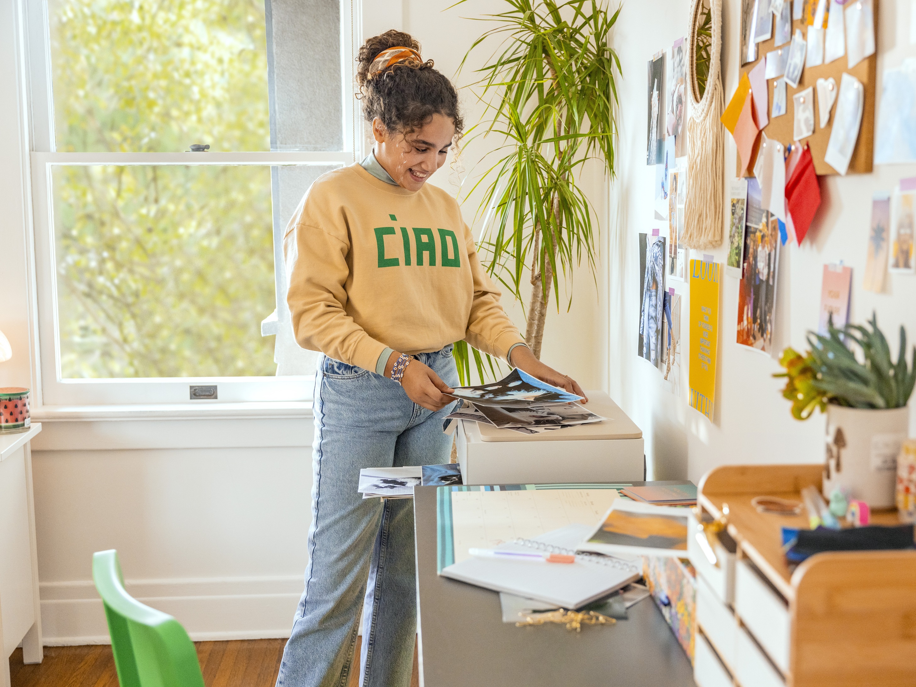 Student printing in dorm with HP Envy Inspire printer and HP All-In Plan