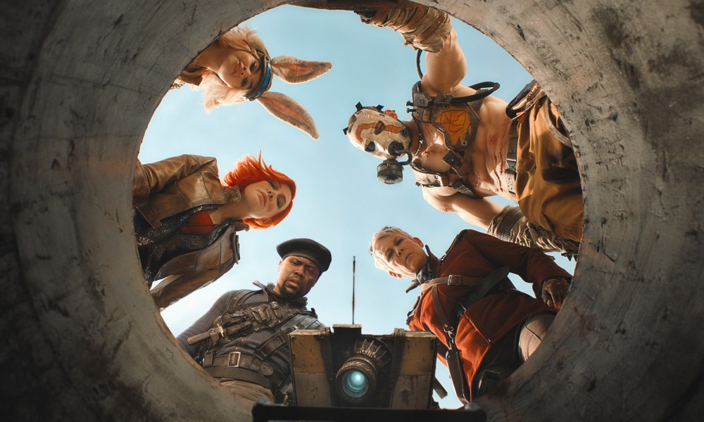 The Borderlands cast looks down a hole together.