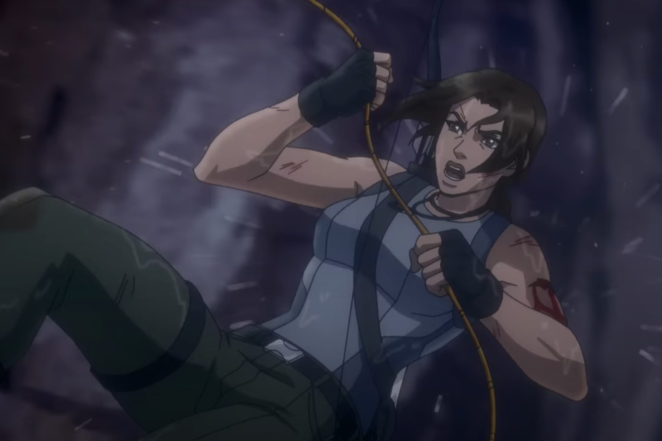 Lara Croft holds onto a rope as she swings in Tomb Raider: The Legend of Lara Croft.