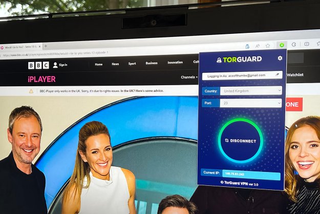 TorGuard's browser extension is open on a BBC website displayed on a PC monitor.