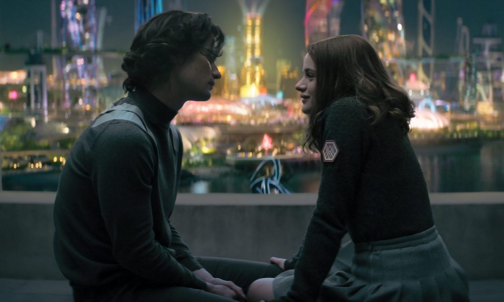 A boy and a girl hold hands in a room overlooking the city.